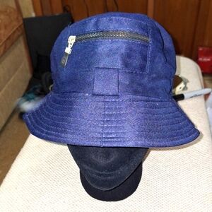 A blue bucket hat with a pocket. Unbranded  like new condition.